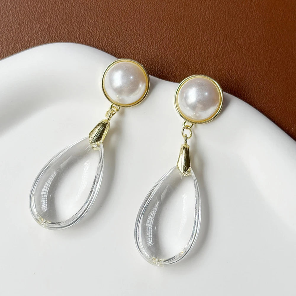 Bold dangling pearl earrings