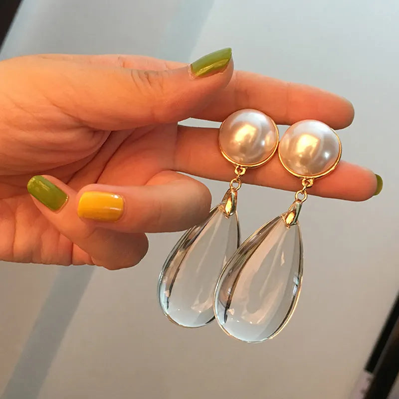 Bold dangling pearl earrings